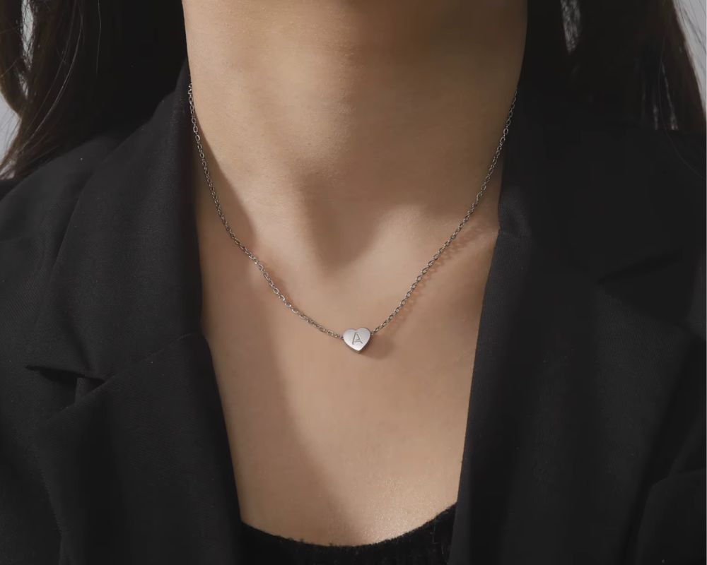 A minimalist silver heart necklace with an engraved “A”—simple, and endlessly meaningful