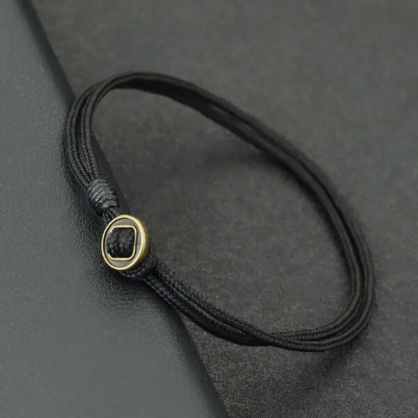 Black Paracord Rope Bracelet with Bronze Ring