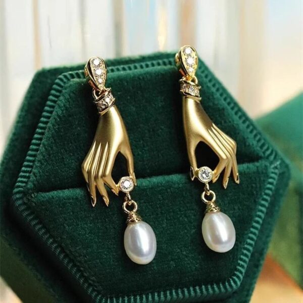 Gold Gilded Hand Earrings Holding Crystal and Pearl Teardrop (1)