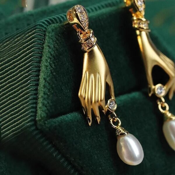 Gold Gilded Hand Earrings Holding Crystal and Pearl Teardrop (2)