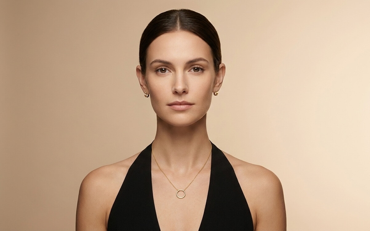 Balanced pairing of earrings and necklace with clear visual hierarchy